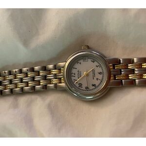 Acqua Ladies watch with Indiglo. Great condition. Silver and Gold.